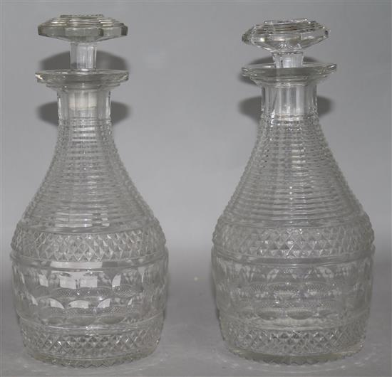 A pair of Regency cut glass decanters 21.5cm.